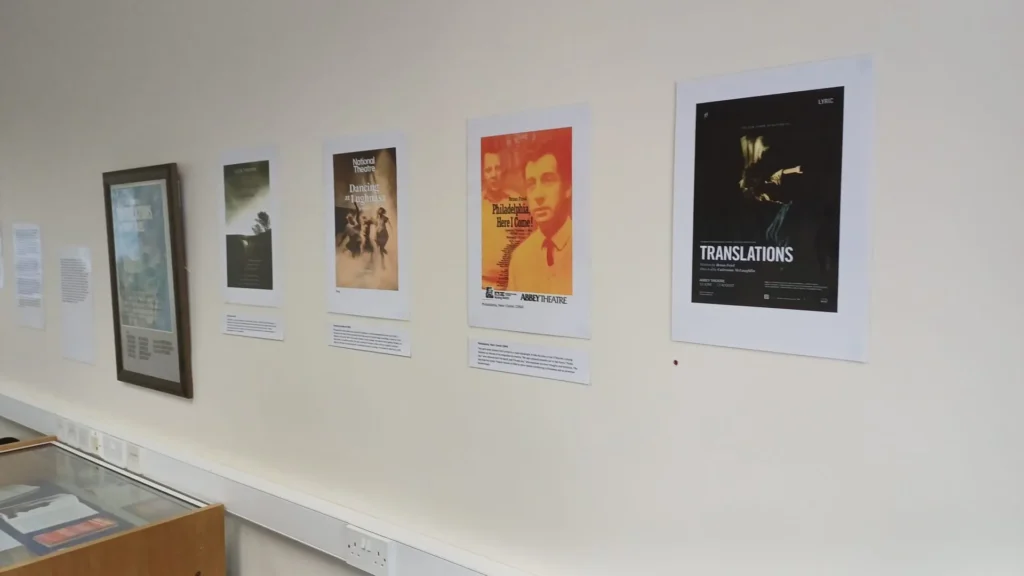 brian friel exhibition posters and frames on wall